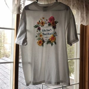 “Life Isn’t That Rad.” White floral T-Shirt